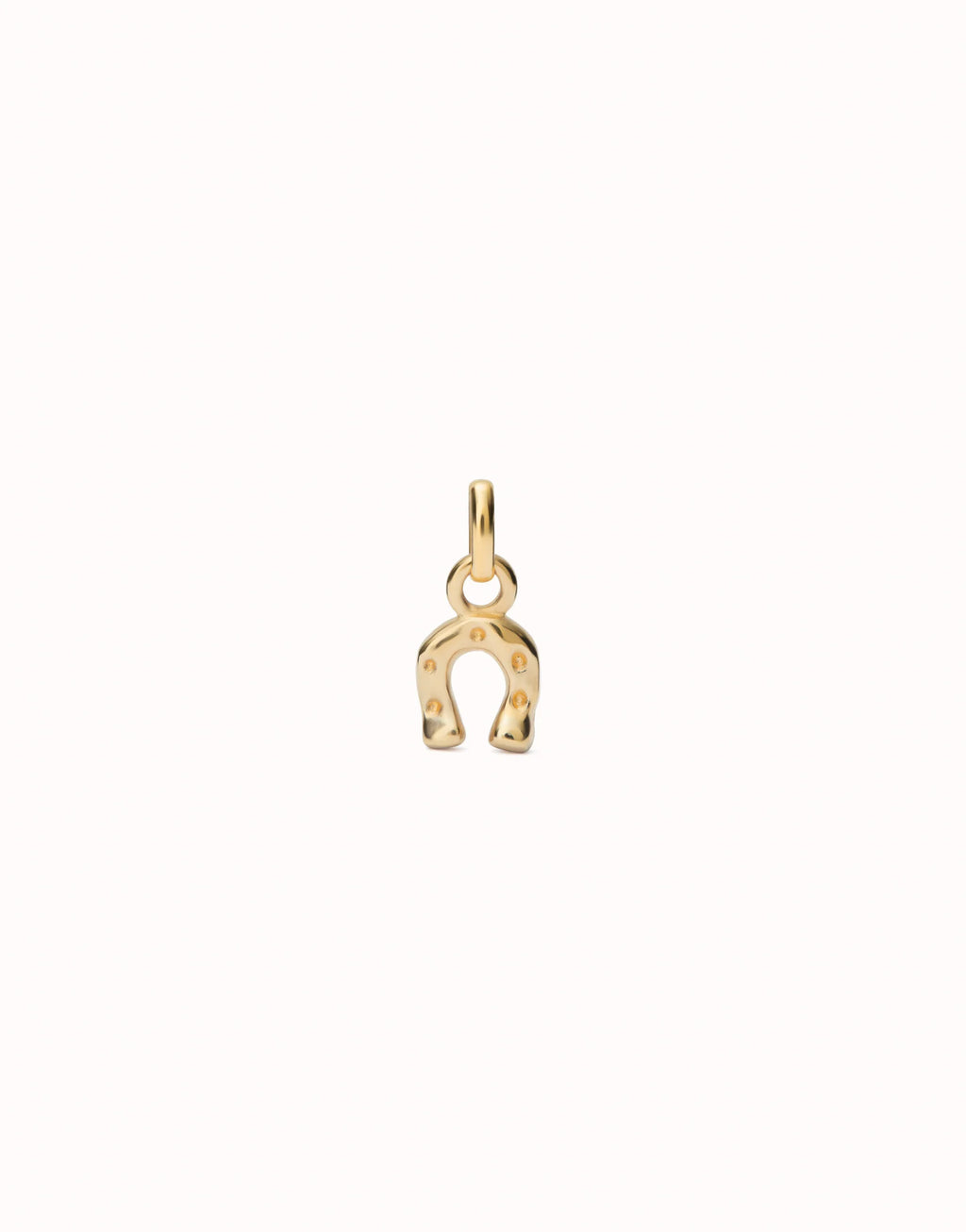 UNO DE 50 - Charm bañado en oro 18k con forma de herradura.