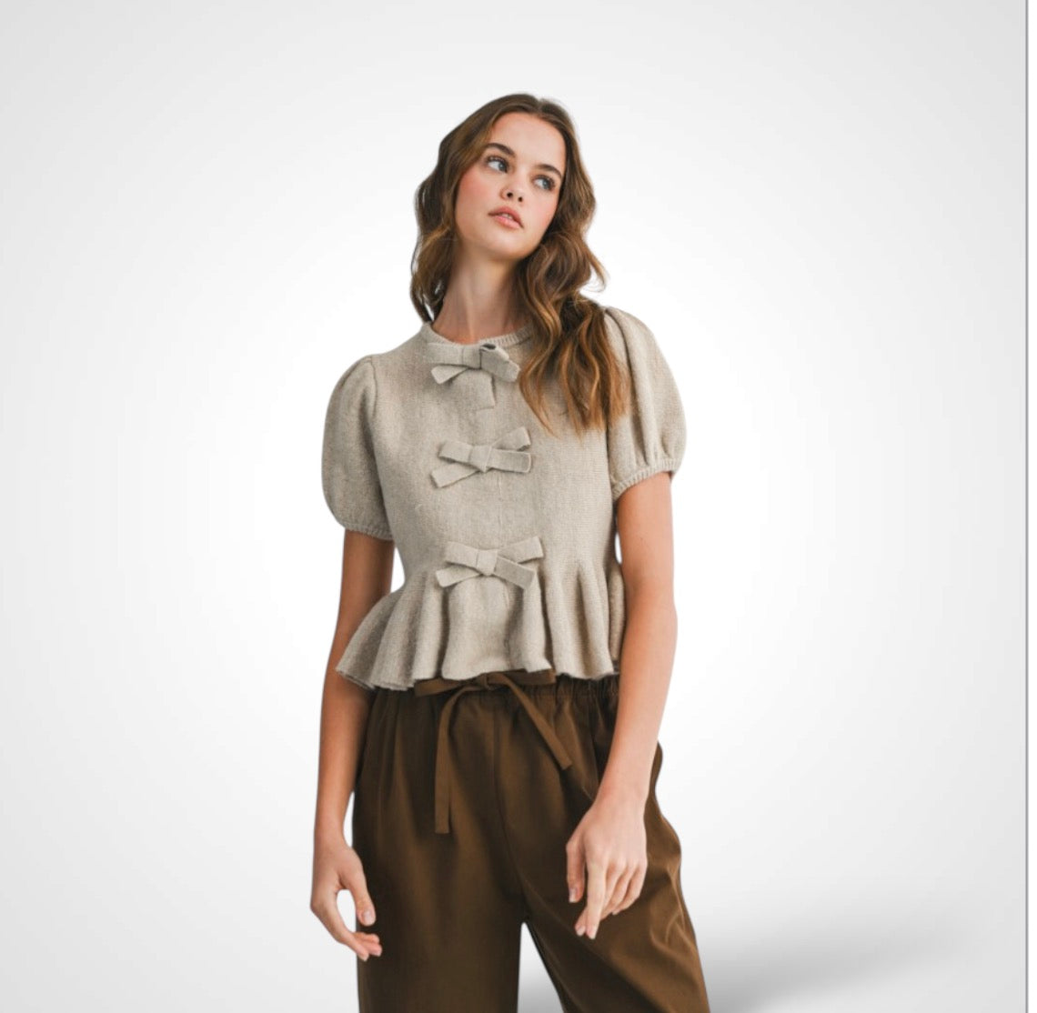 PEPLUM KNIT TOP WITH BOW DETAIL