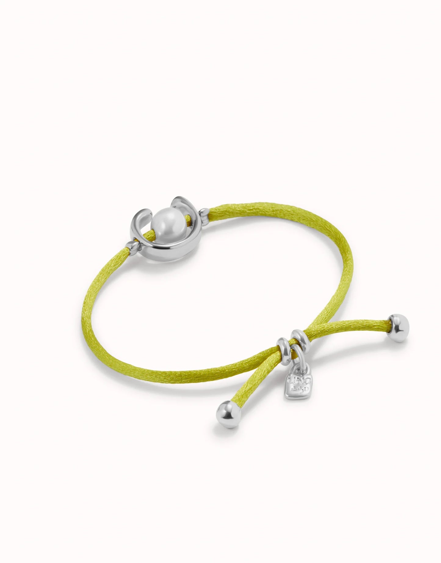 UNO DE 50 - Pulsera de hilo lima con perla shell fornitura bañada en plata de ley.