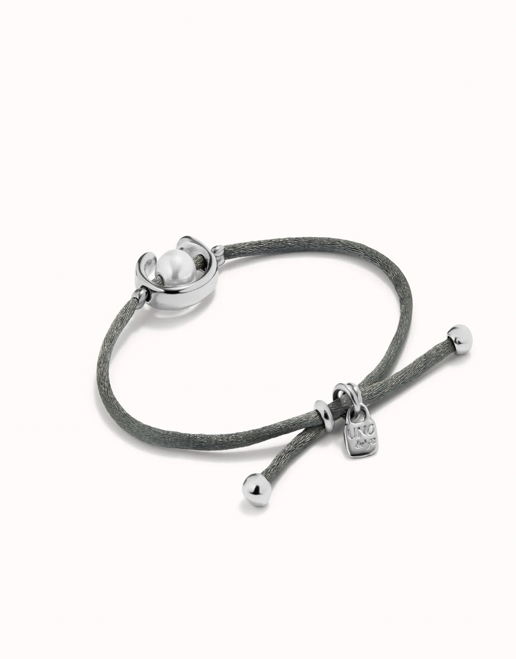UNO DE 50 - Pulsera de hilo negroso con perla shell fornitura bañada en plata de ley.