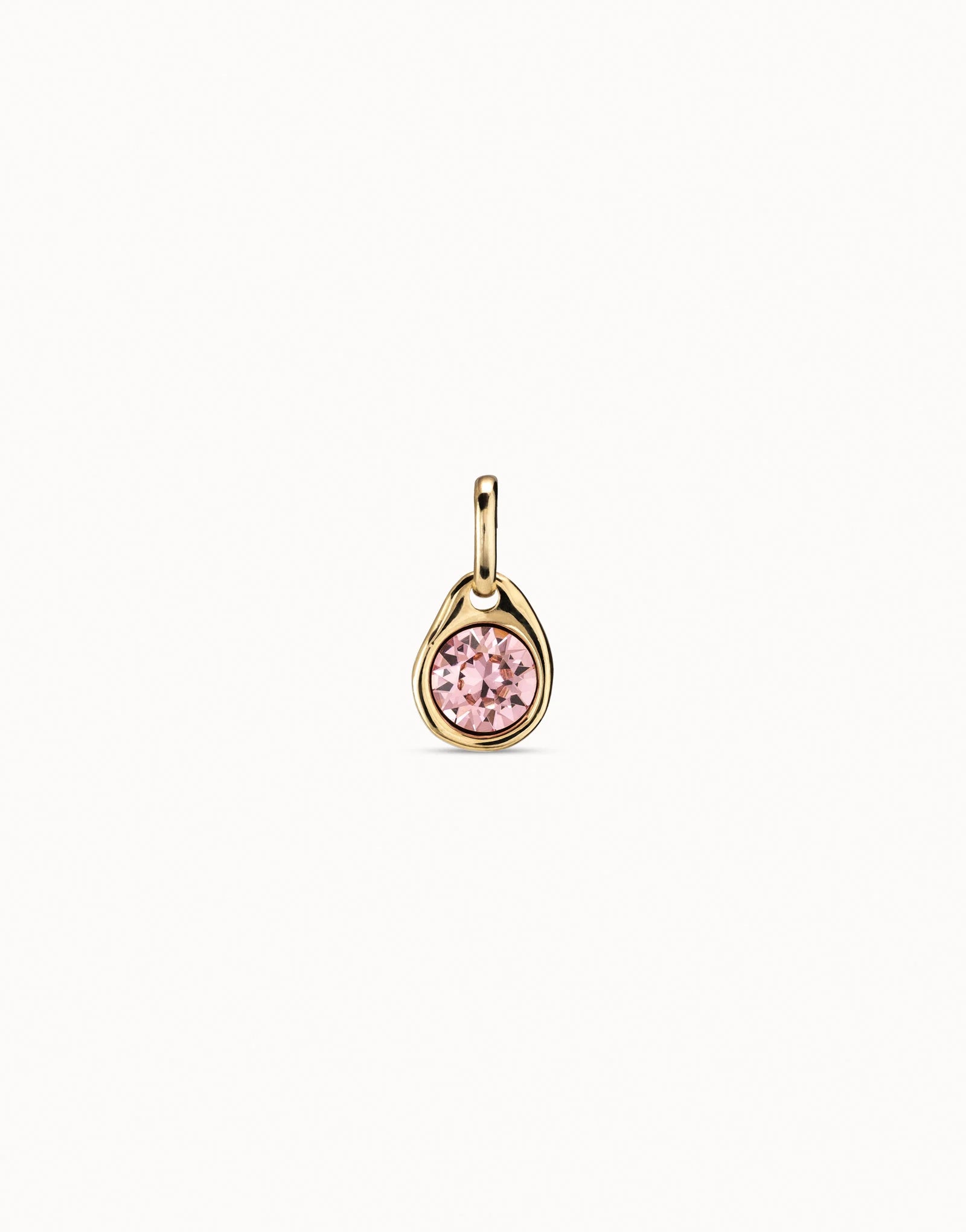 Charm bañado en oro con cristal rosa•
