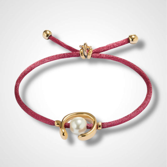 UNO DE 50 - Pulsera de hilo malva con perla shell fornitura bañada en oro.