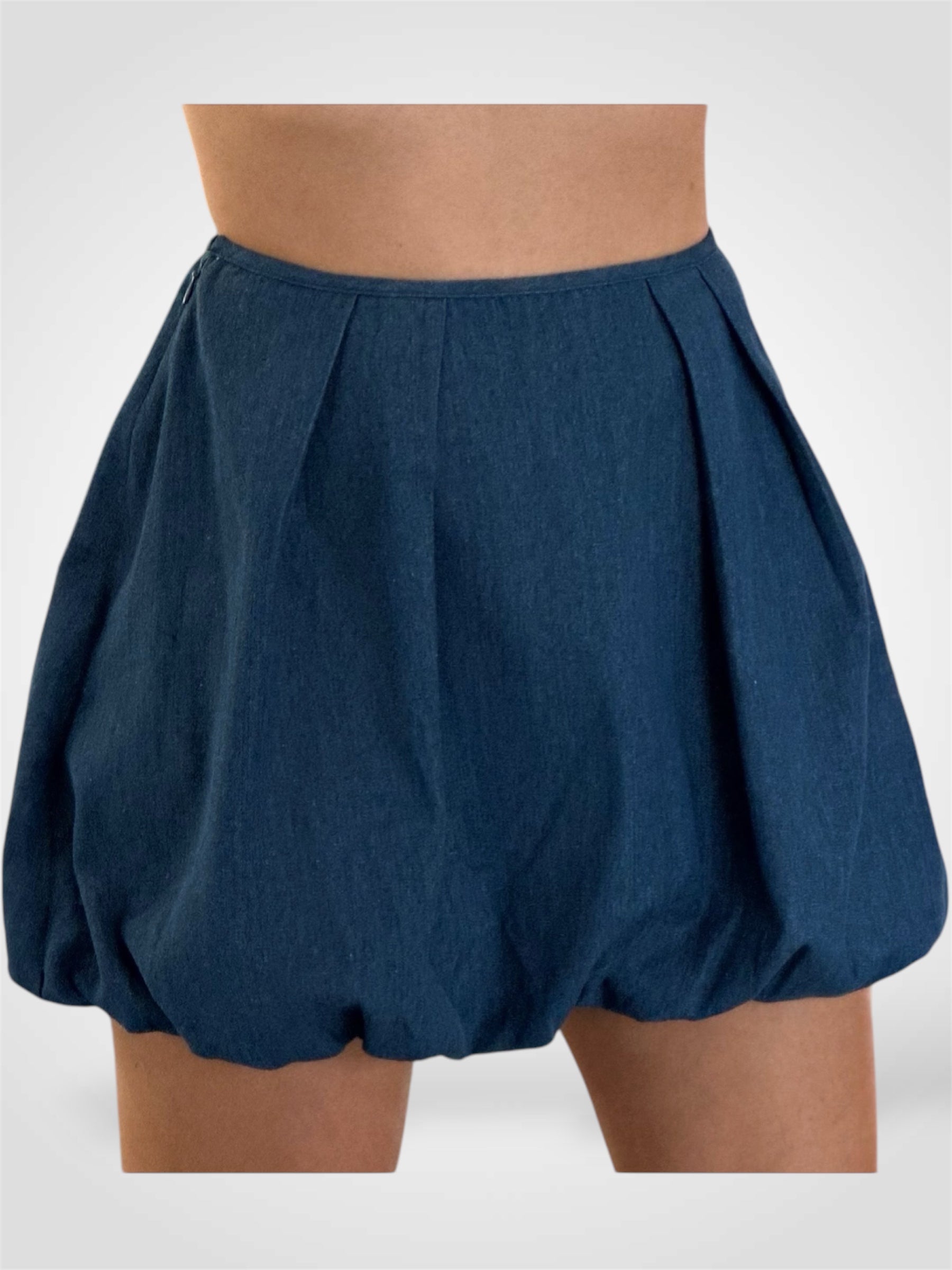 DENIM MINI BUBBLE HEM SKIRT WITH PLEATS DETAIL•
